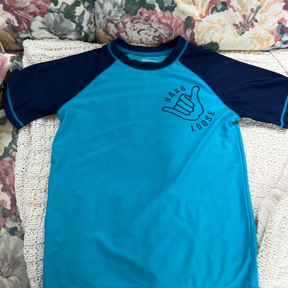 Swim rash guests short sleeve , never dried always air dried .